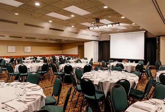 A ballroom set up for a banquet.